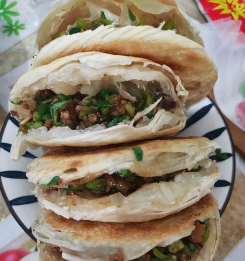 如何制作美味的肉夹馍饼胚（一步步教你制作蓬松软糯的肉夹馍饼胚）